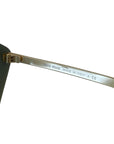 Miu Miu sunglasses Pentagon black/gold grey gradient lenses