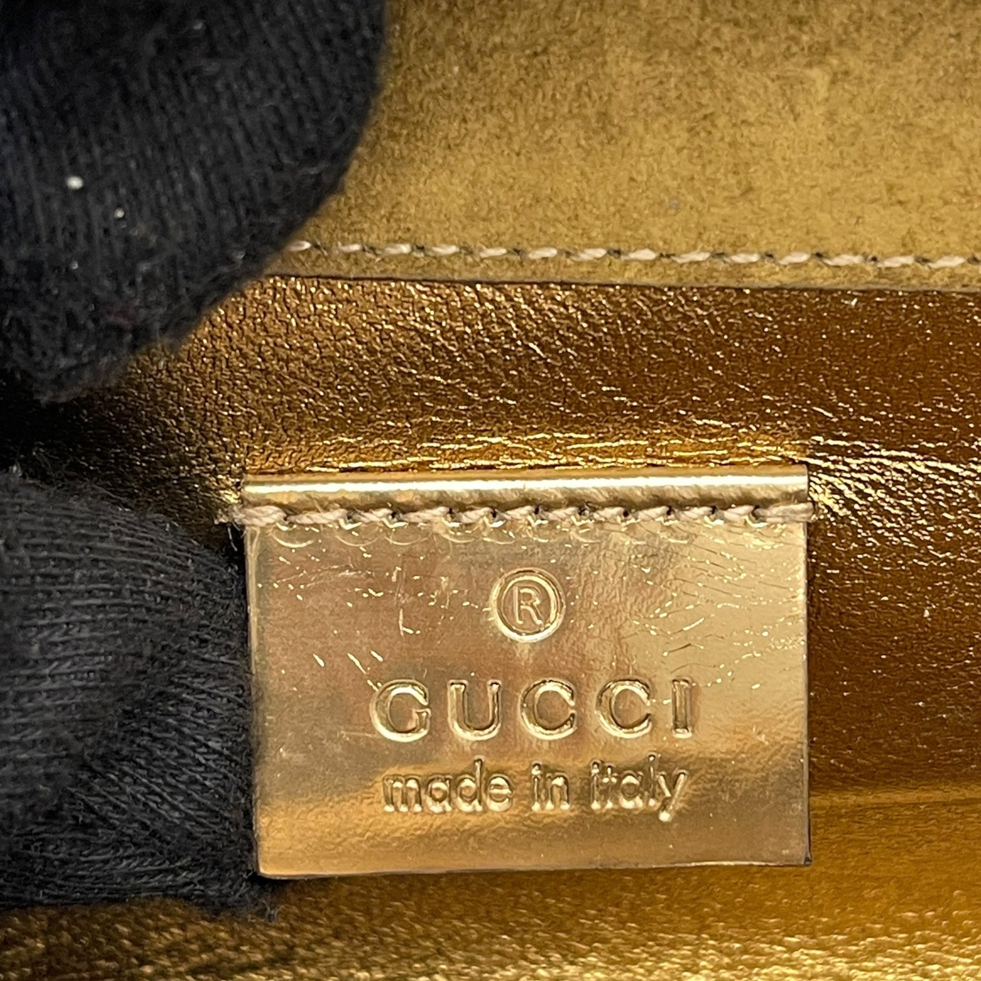 Gucci Gold Leather Romy Clutch